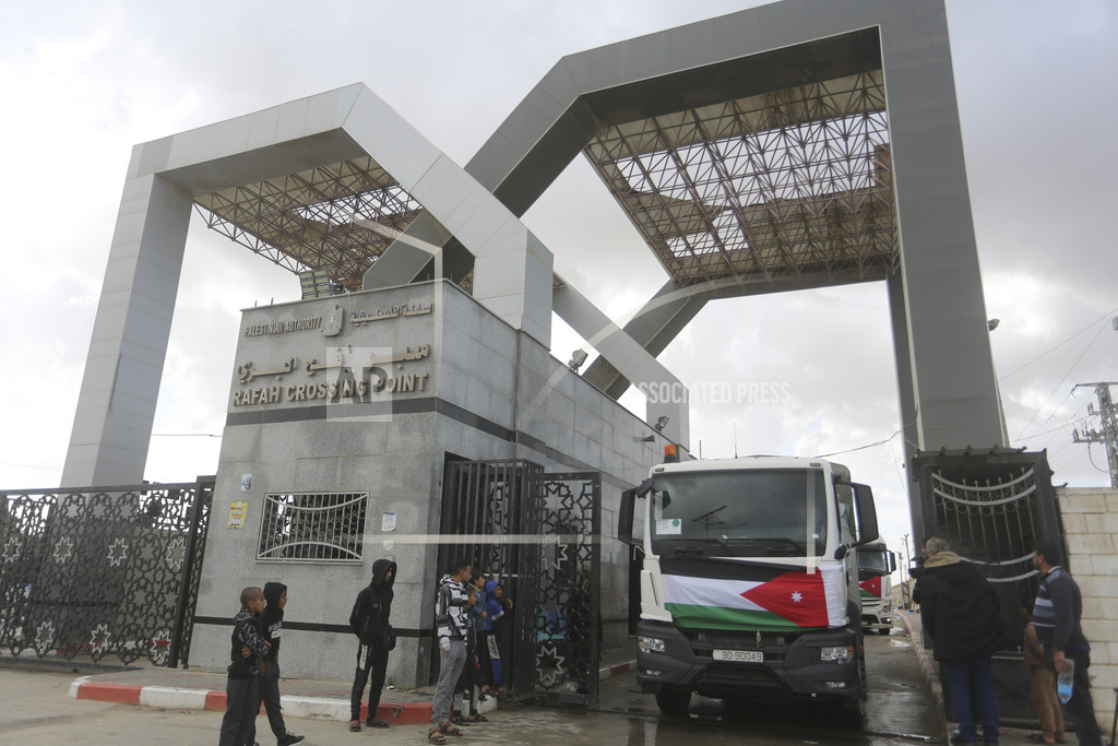 Trucks carying humanitarian aid line up in Rafah, Egypt