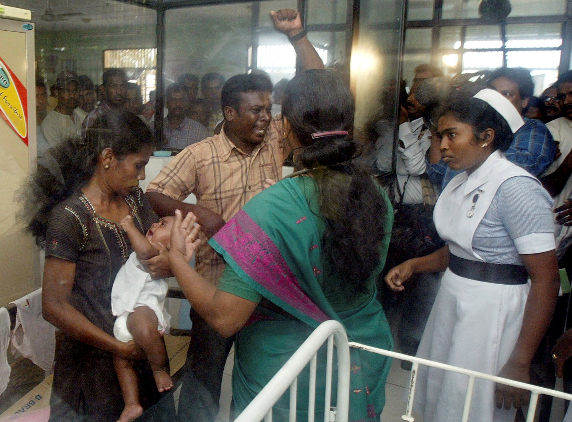 FILE - Jenita Jayarasa, left, the mother claimant of the infant dubbed 