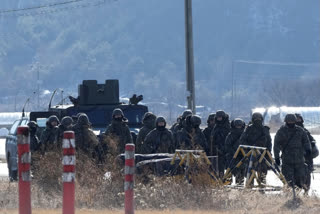 South Korean army soldiers move during a military exercise in Paju, South Korea, near the border with North Korea, Wednesday, Jan. 24, 2024. South Korea's military says North Korea fired several cruise missiles into waters off its western coast, adding to a provocative run of weapons demonstrations in the face of deepening nuclear tensions with the United States, South Korea and Japan.