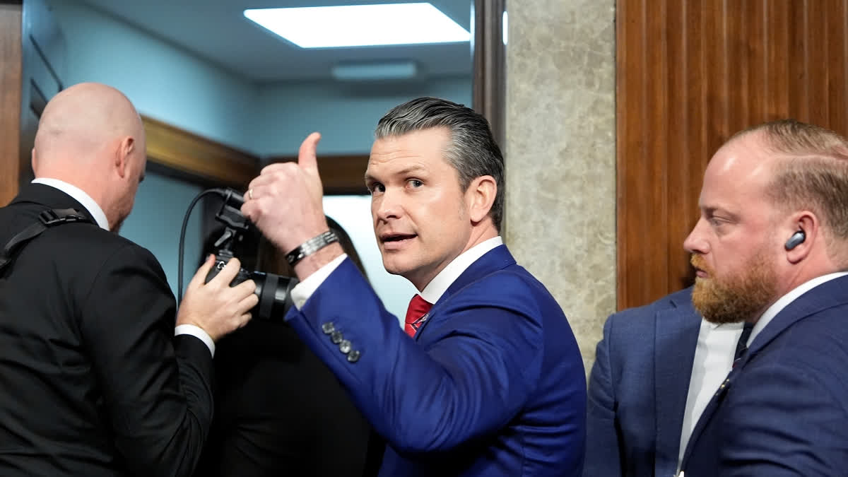 Pete Hegseth, President-elect Donald Trump's choice to be Defense secretary, gives a thumbs up while leaving after his Senate Armed Services Committee confirmation hearing, at the Capitol in Washington, Tuesday, Jan. 14, 2025.