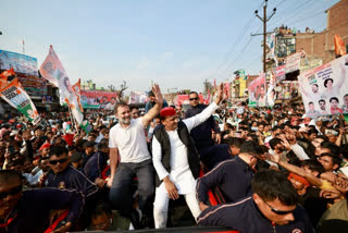 Rahul Gandhi in White T shirt left , Akhilesh in White Kurta Right