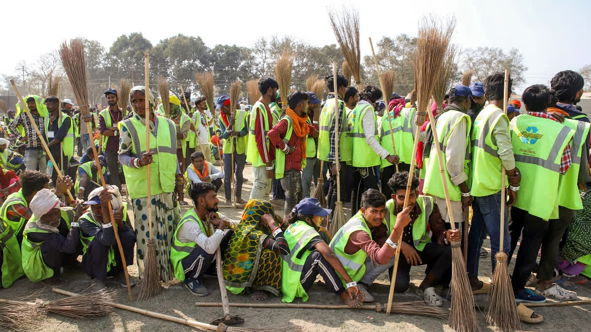 Maha Kumbh Mela Authority deploys more than 15,000 sanitation workers to clean the Ganges at multiple locations along the river's ghats to set a Guinness World Record for the largest number of people working to clean a river, in Prayagraj on Monday.