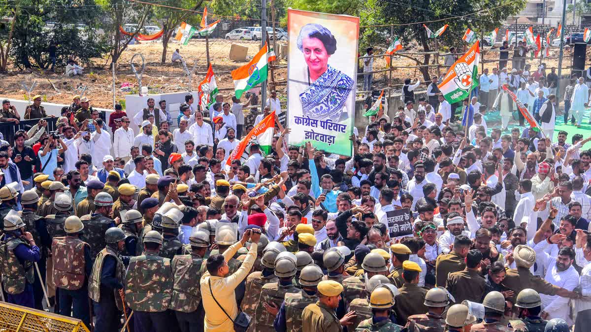 Police personnel block the path of Congress supporters during a protest outside the Rajasthan assembly against state minister Avinash Gehlot's comments regarding former Prime Minister Indira Gandhi, in Jaipur on Monday.