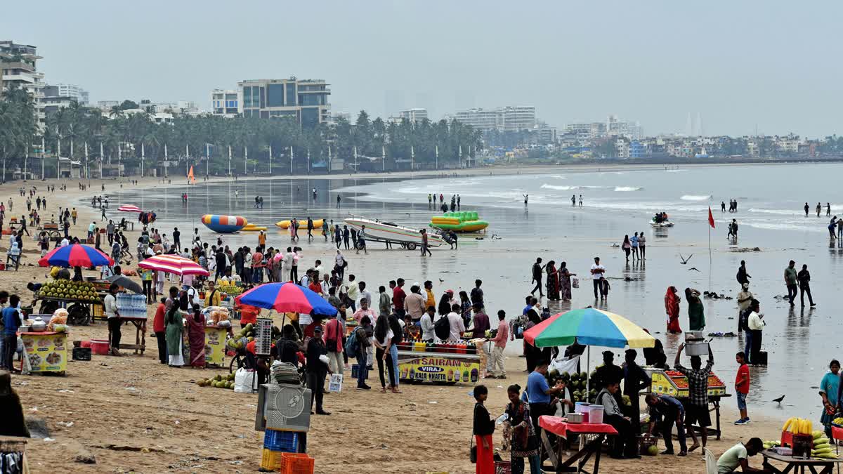 People gather at Juhu Beach in Mumbai