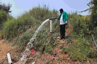 A farmer releasing his borewell water into the river in Shivamogga in Karnataka