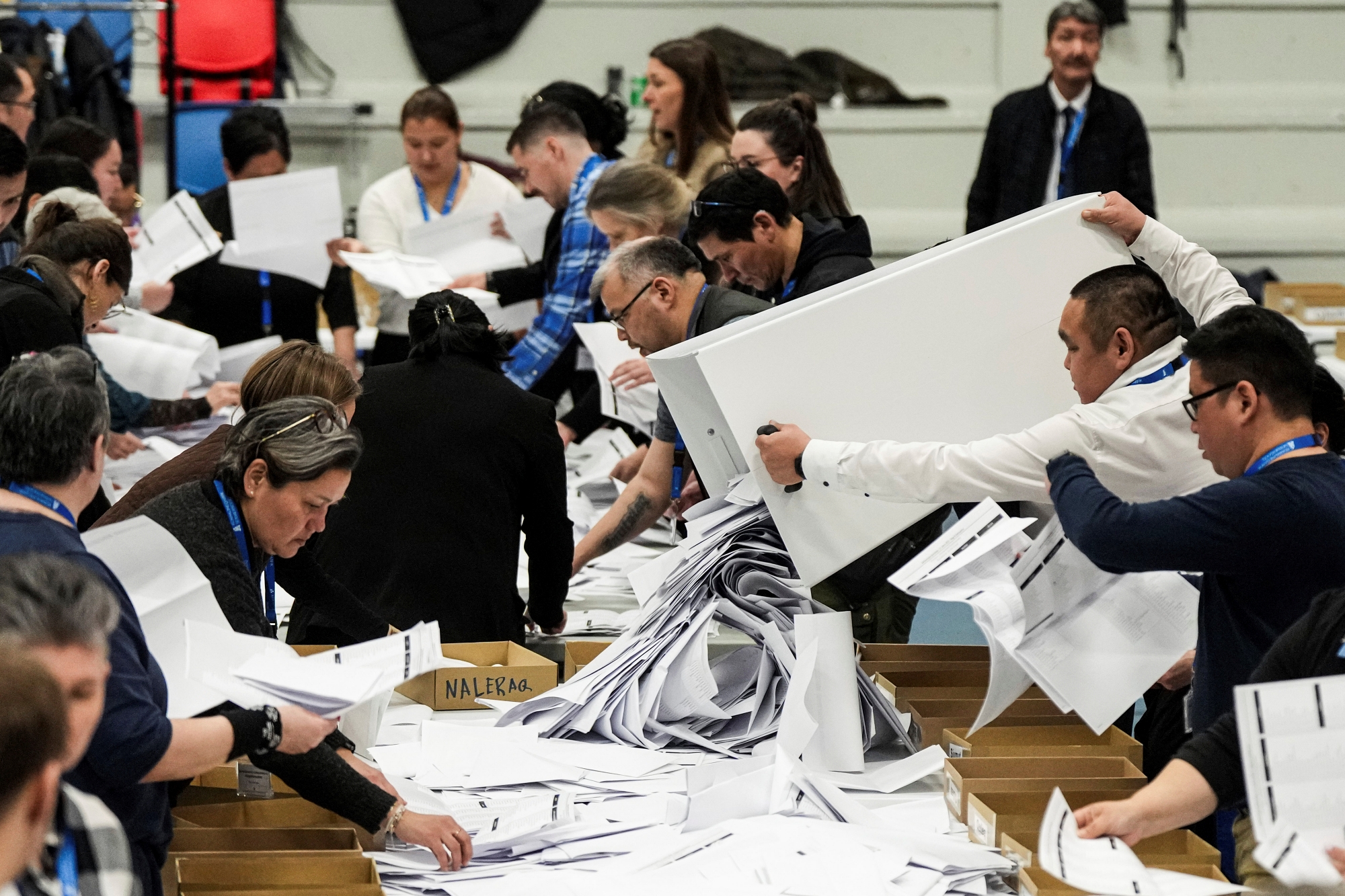 Electoral workers prepare to count votes during parliamentary elections in Nuuk, Greenland, Tuesday, March 11, 2025.