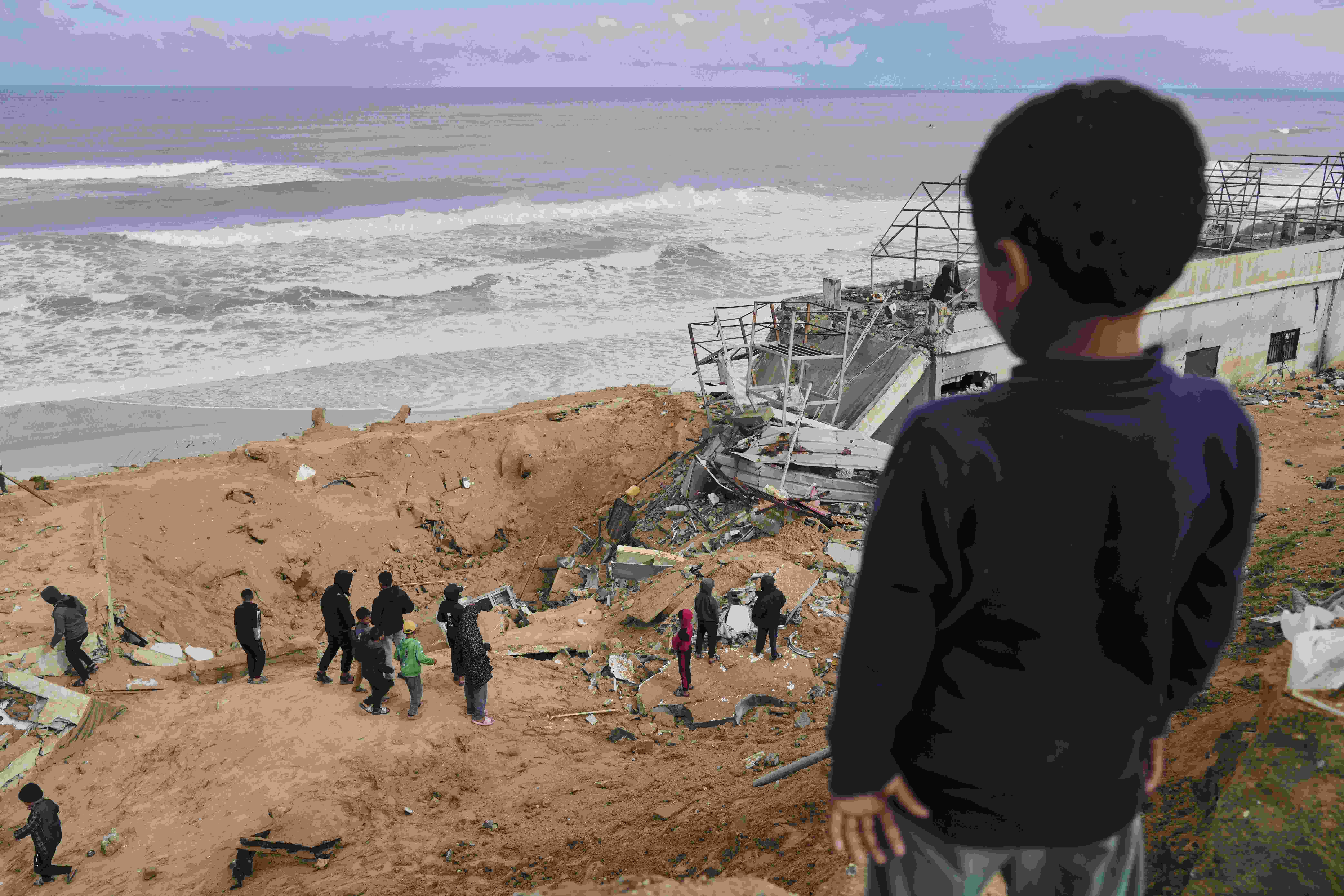 Displaced Palestinians, who flee from Rafah amidst ongoing Israeli military operations following Israel's renewed offensive in the Gaza Strip, arrive in Khan Younis, Gaza, on Sunday, March 23, 2025. (AP)