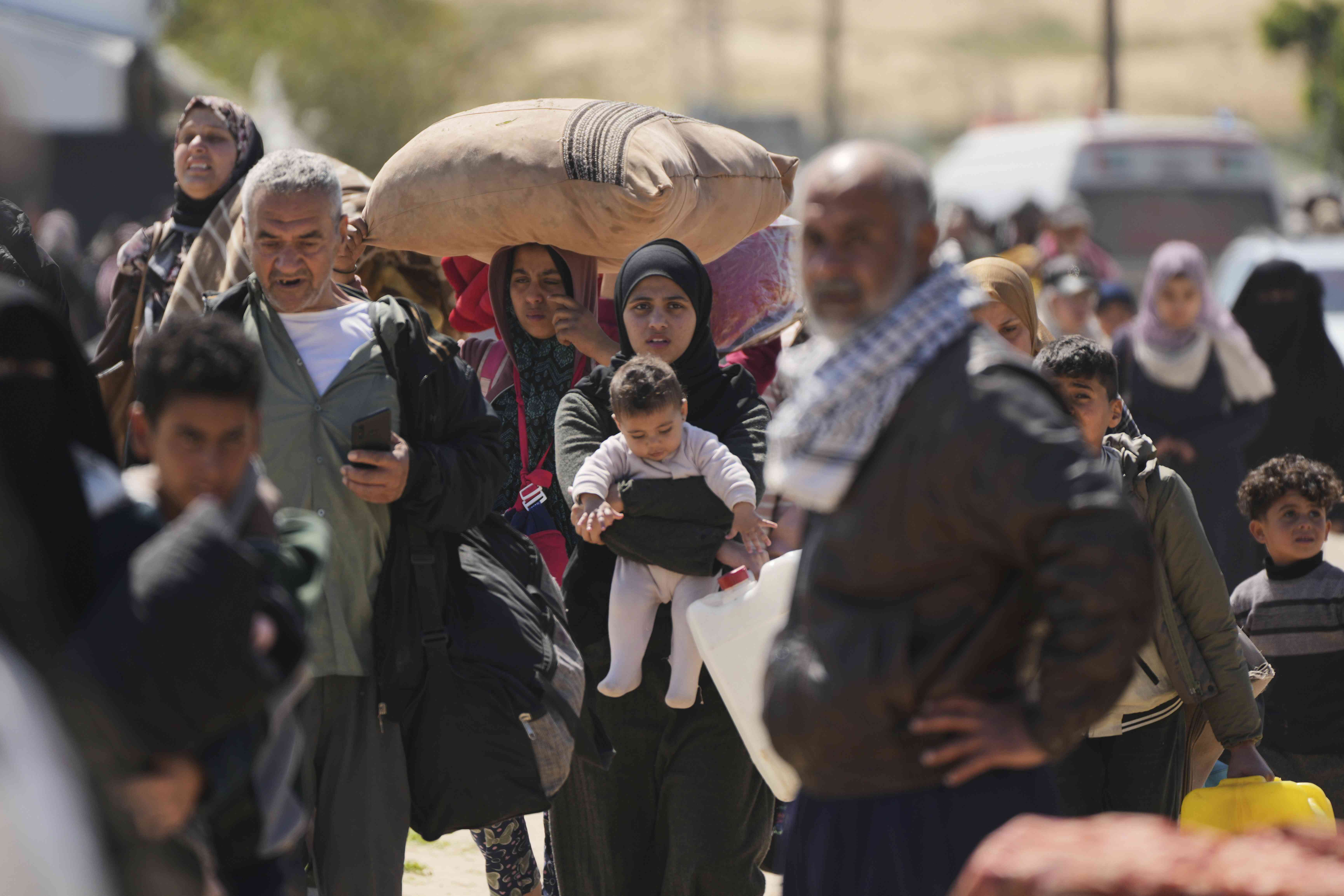 Palestinians carry the body of Ismail Barhoum, a member of Hamas' political bureau who was killed is an Israeli army strike of Nasser Hospital in Khan Younis, Gaza Strip, Monday, March 24, 2025. (AP)