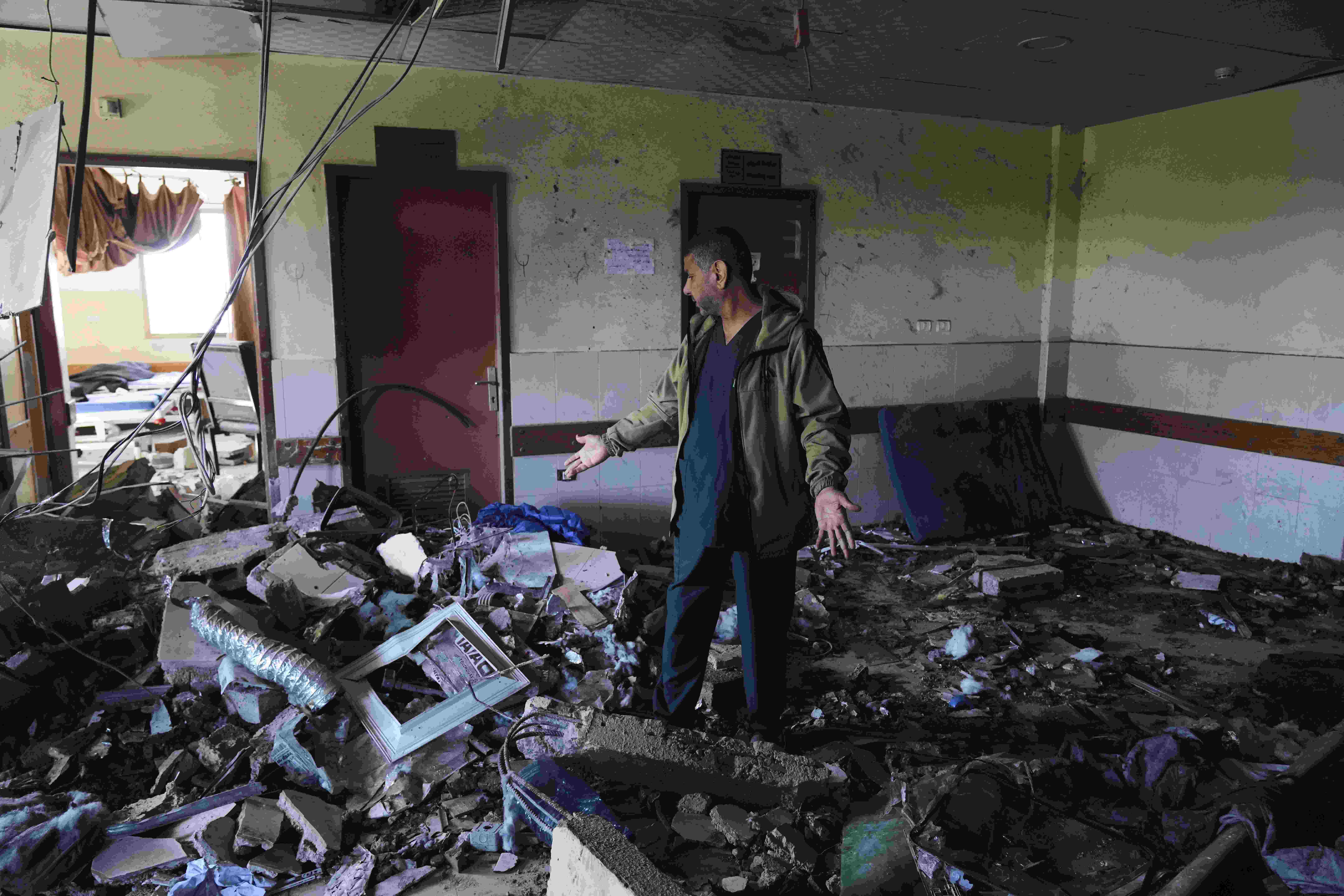 Palestinians inspect the rubble of a structure hit by an Israeli bombardment in Deir al-Balah, Gaza Strip on Saturday, March 22, 2025. (AP)