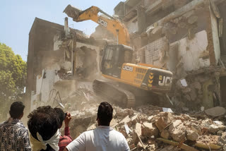 The house of Fahim Khan, alleged mastermind behind the Nagpur riots, being demolished, after he failed to remove an illegal structure within a 24-hour deadline, in Nagpur, Monday, March 24, 2025.