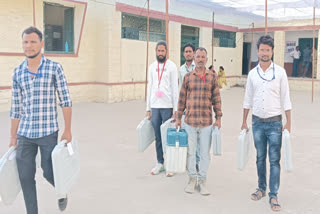 Election workers heading towards polling stations in Chittorgarh
