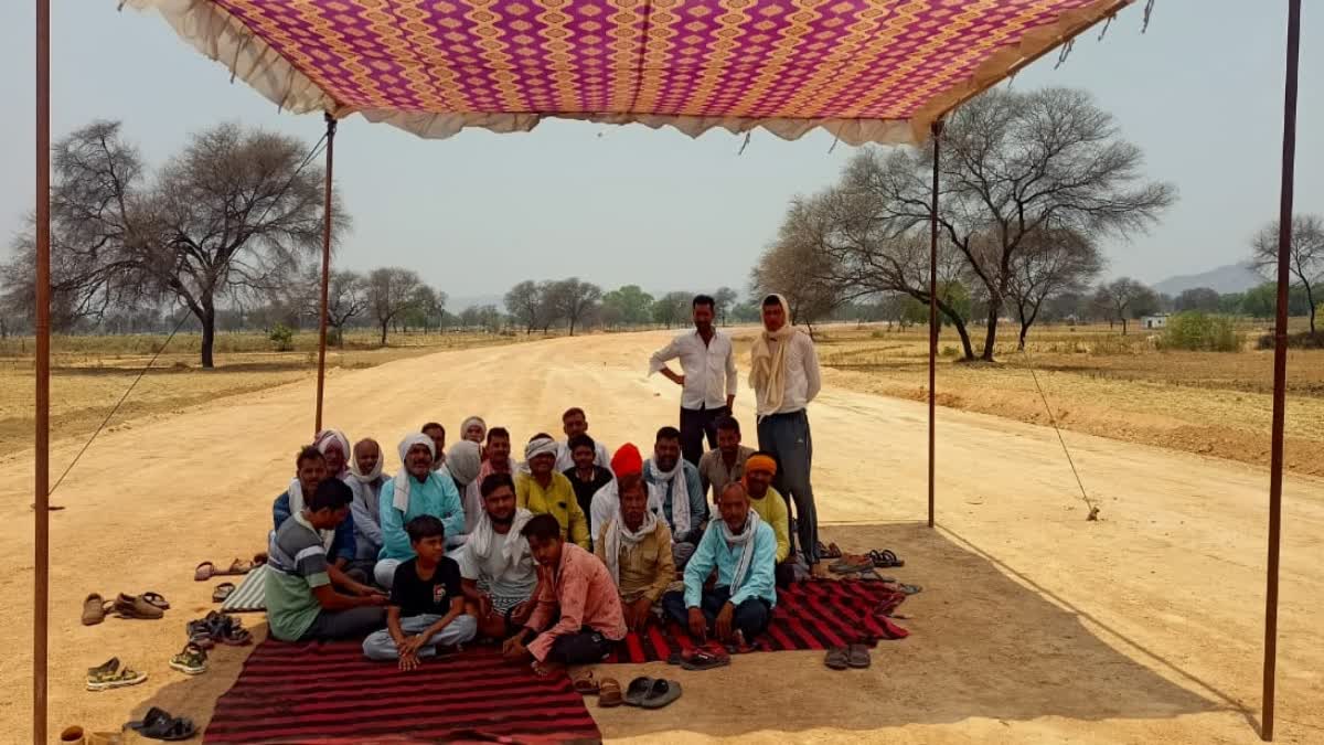 Villagers sitting on protest by setting up tents