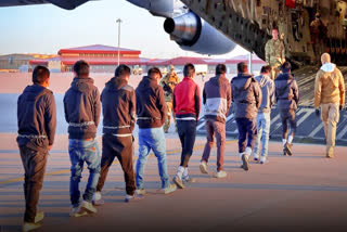 The White House shared a photo of expelled migrants being moved into one of the military planes.