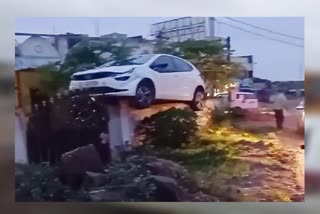 CAR LANDS ON HOUSE WALL