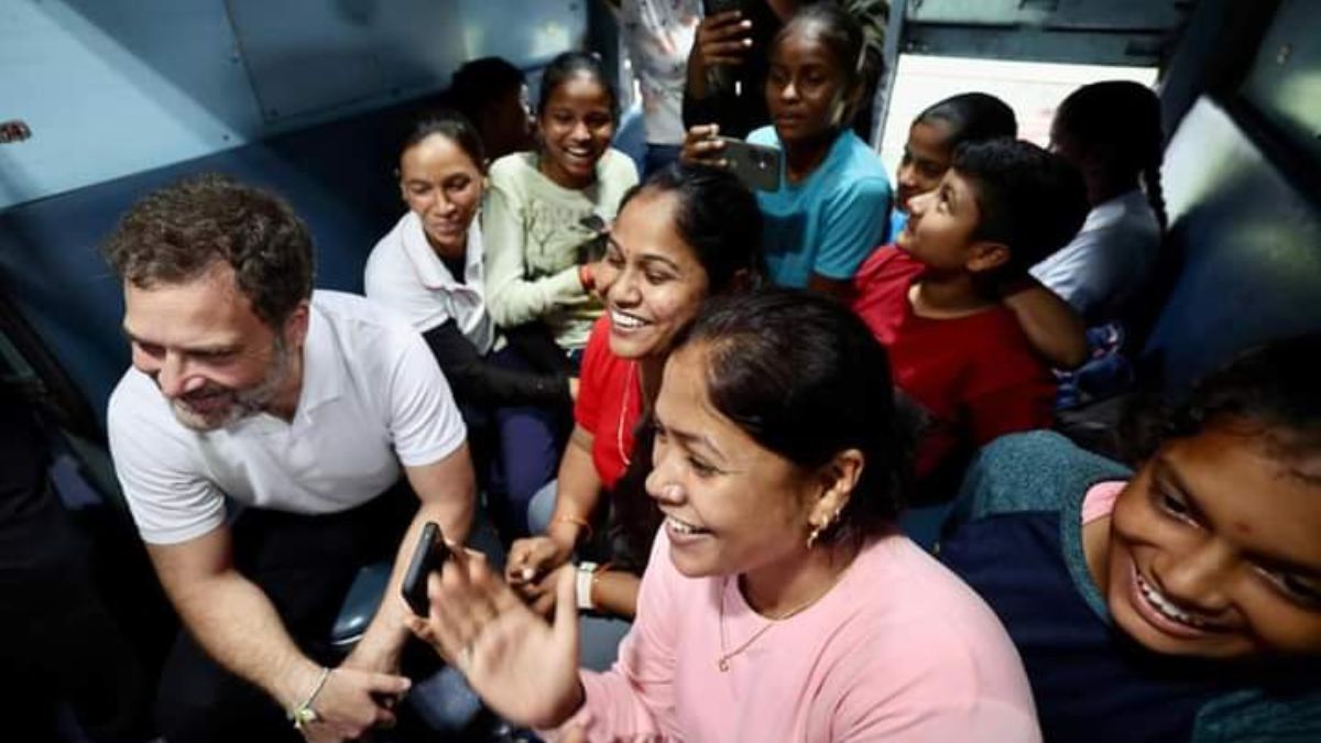 Rahul Gandhi talking to passengers in the train