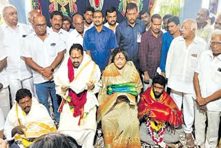 MLA Talari Venkatarao sitting at Tammineni Sitaram Feet