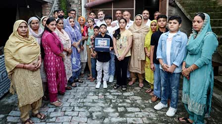 Rahul Gandhi with the family members of a youth from Haryana who took alleged donkey route to USA