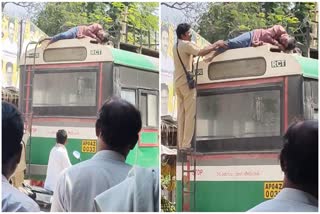 A Drunken Man Sleep on Top of the RTC Bus