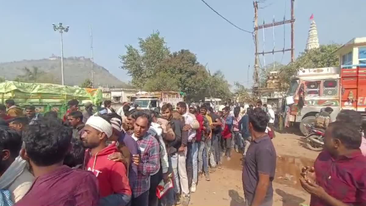 Farmers standing in line for fertilizer