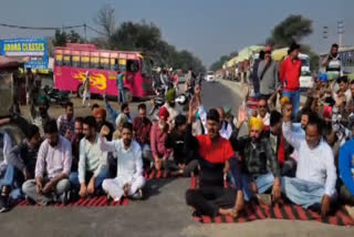 businessmen are sitting on a dharna, blocking the Bathinda-Sunam highway and raising slogans against the administration