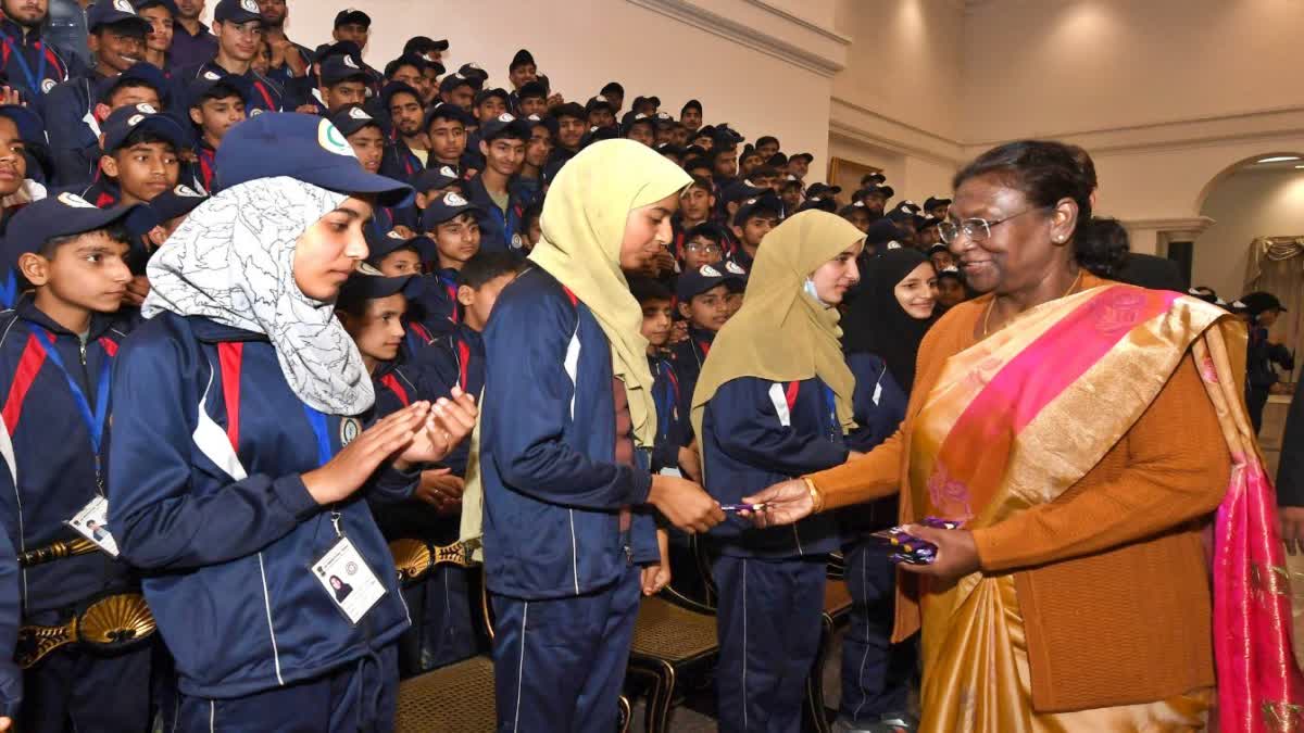 President giving chocolates to children