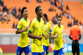 Fernando Diniz, left, the new head coach of the Brazil's national soccer team, and Brazilian Soccer Confederation President Ednaldo Rodrigues, right, embrace during a media presentation in Rio de Janeiro, Brazil, July 5, 2023. A Rio de Janeiro state court has removed Rodrigues from office because of irregularities in the proceedings that led to his election last year.