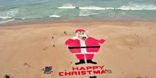 WORLD BIGGEST CANDY SANTA CLAUS  SAND ARTIST SUDARSHAN PATNAIK  PURI BLUE FLAG BEACH  ಅತಿದೊಡ್ಡ ಸಾಂಟಾ ಕ್ಲಾಸ್