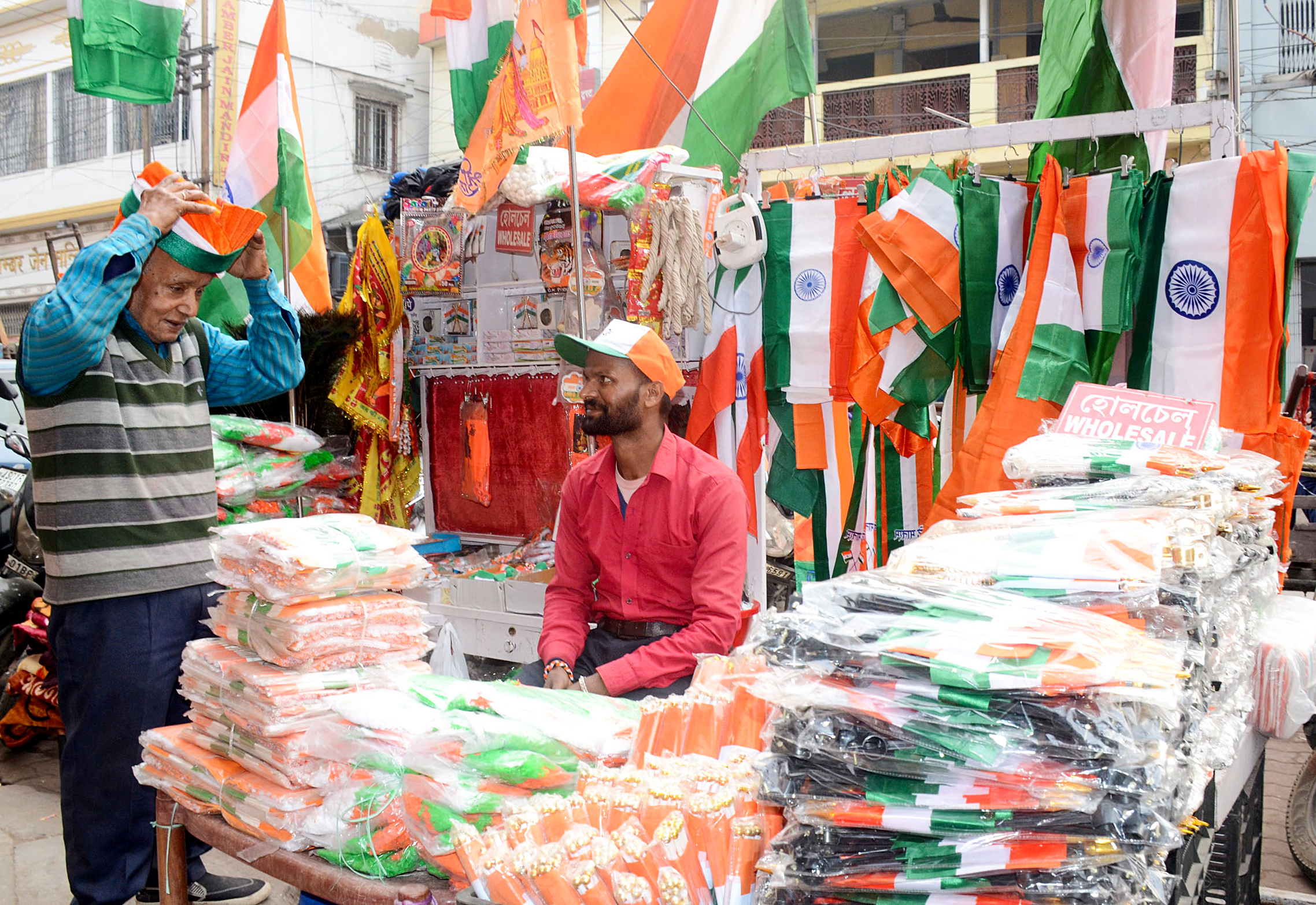 A vendor sells national flags ahead of the 76th Republic Day celebration, at Fancy Bazar in Guwahati on Friday.