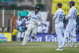 Dhruv Jurel runs to celebrate India winning the match as Ollie Pope and Ben Foakes look on