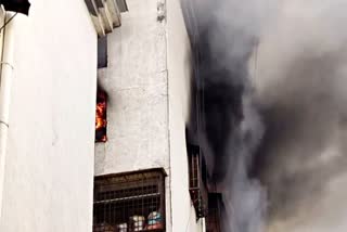 Smoke rising after a fire broke out in Surat's textile market