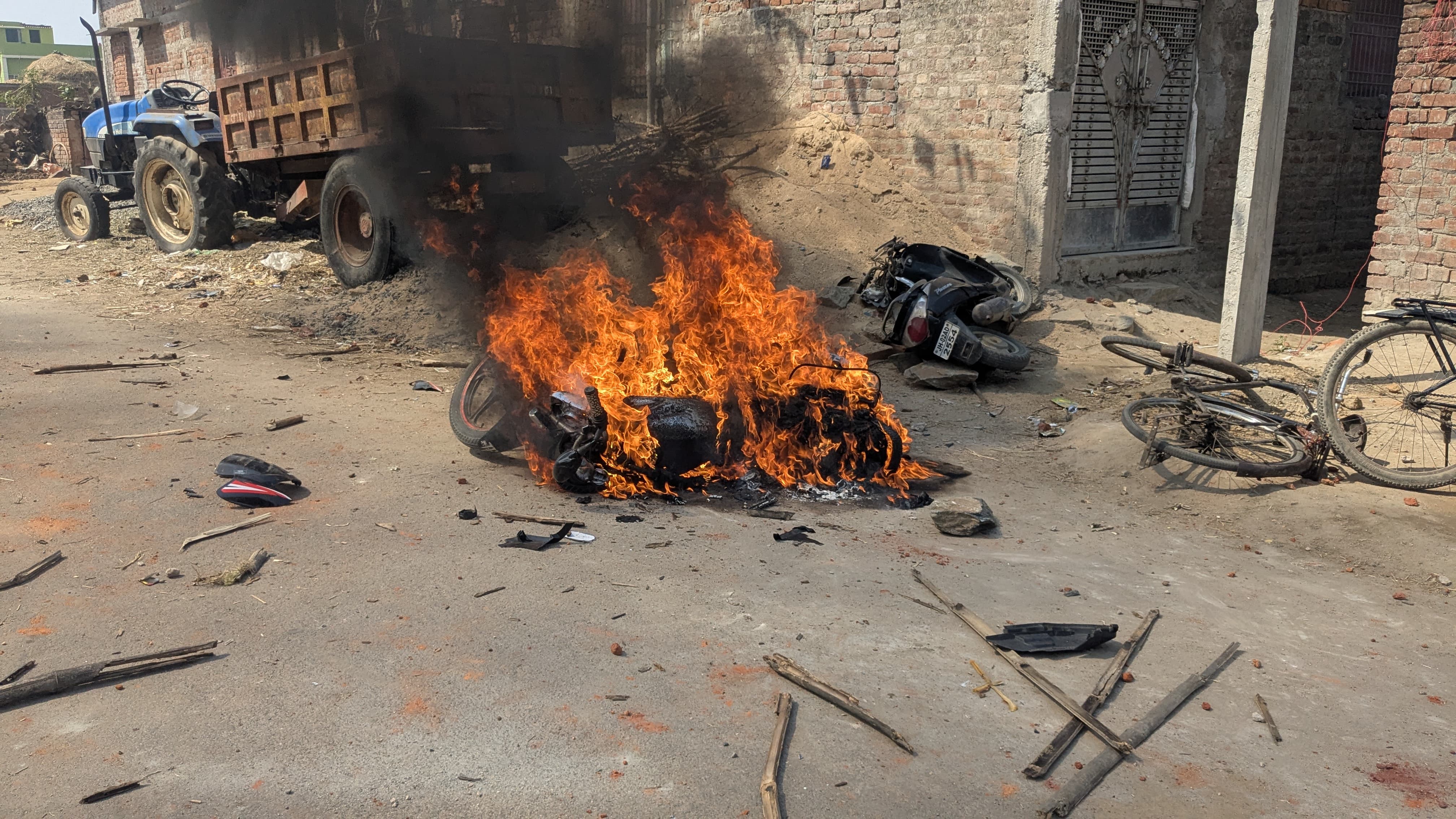 Tyres burning on the road after the clash.