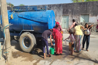 Local people taking water from tanker