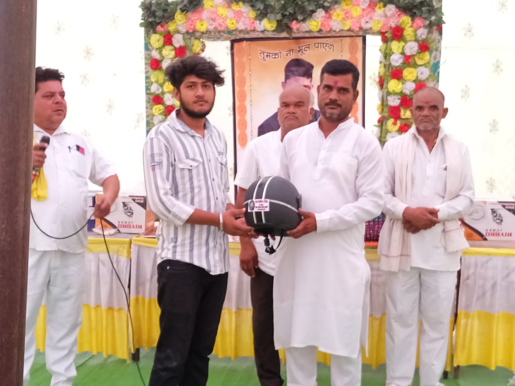 FATHER DISTRIBUTED HELMETS IN DAMOH