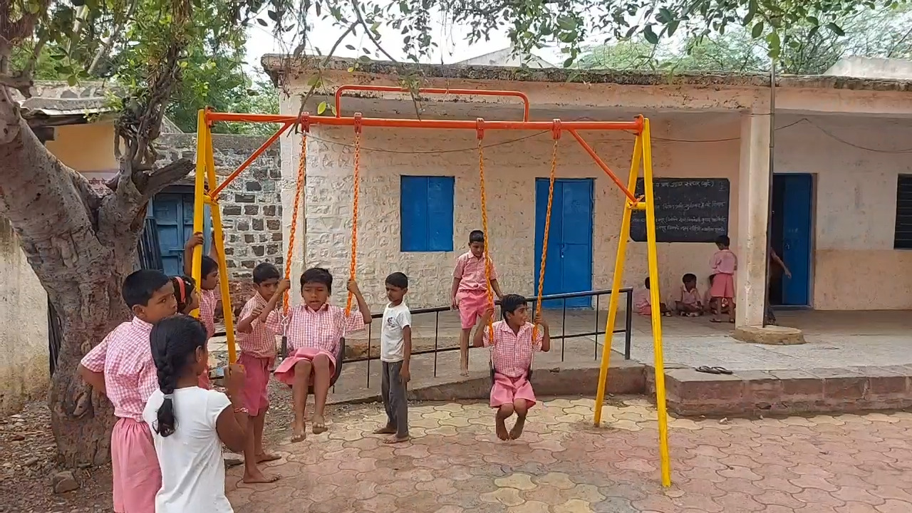 Woman Sarpanch teaching students