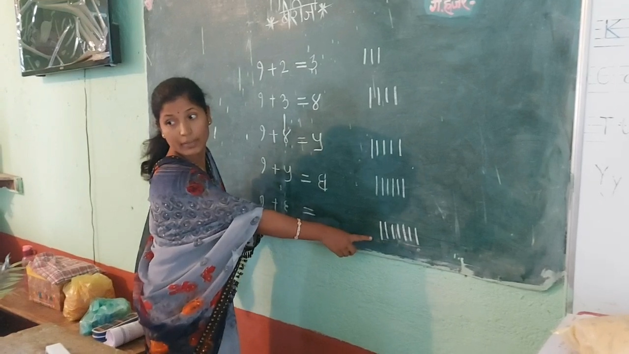 Woman Sarpanch teaching students