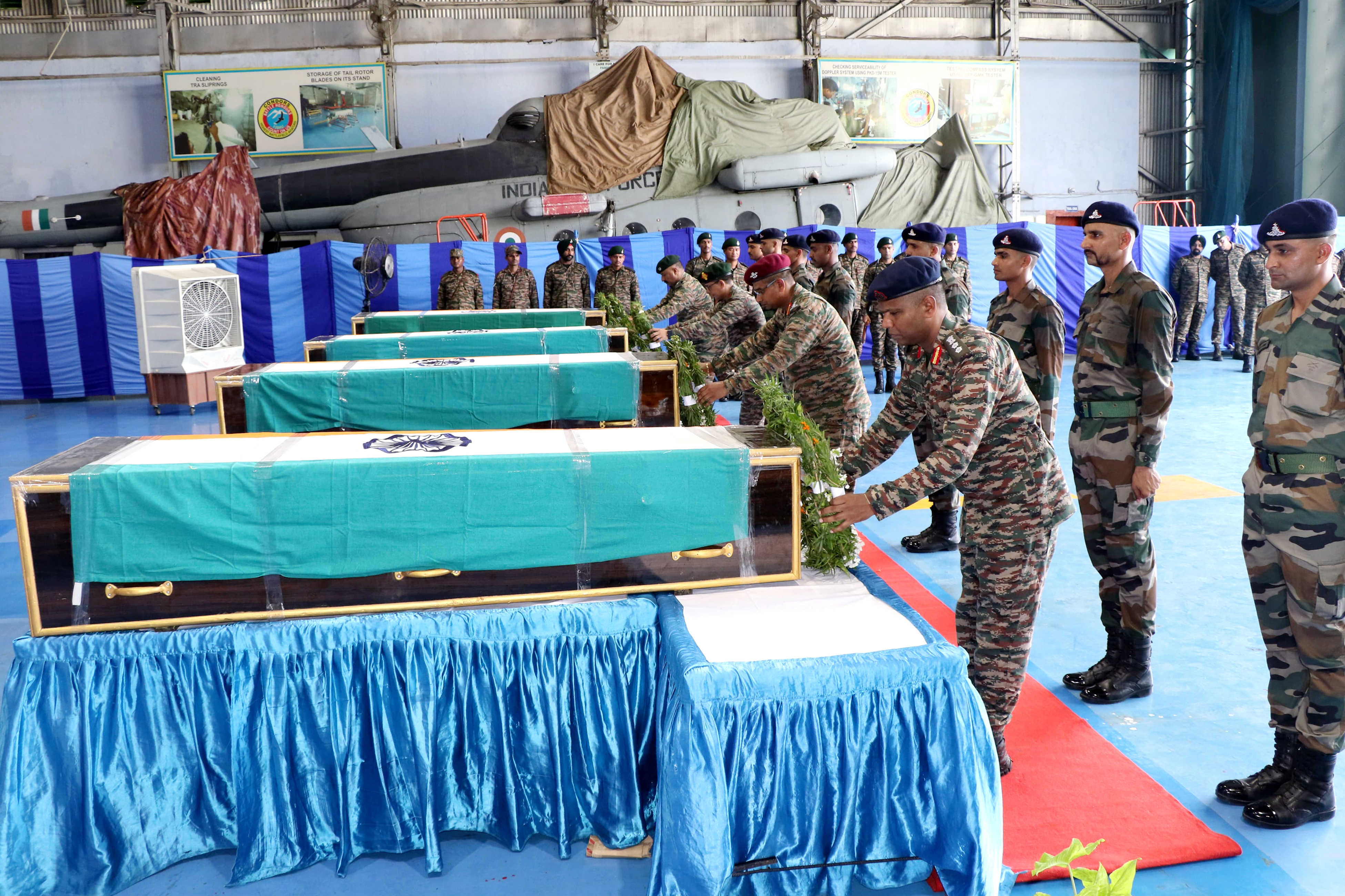 Army personnel pay last respects to the mortal remains of soldiers who lost their lives in action during an encounter with terrorists in Doda on July 16.