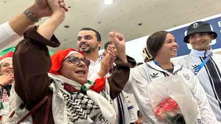 Palestinian Olympic team greeted with cheers and gifts in Paris