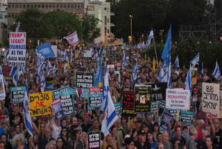 People attend a rally calling for the end of the war and the immediate release of hostages held by Hamas in the Gaza Strip, as they gather in Tel Aviv, Israel, Thursday, July 24, 2025.