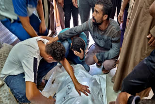 Palestinians mourn a relative killed in the Israeli bombardment of the Gaza Strip, at a hospital in Khan Younis, Saturday, Aug. 24, 2024.