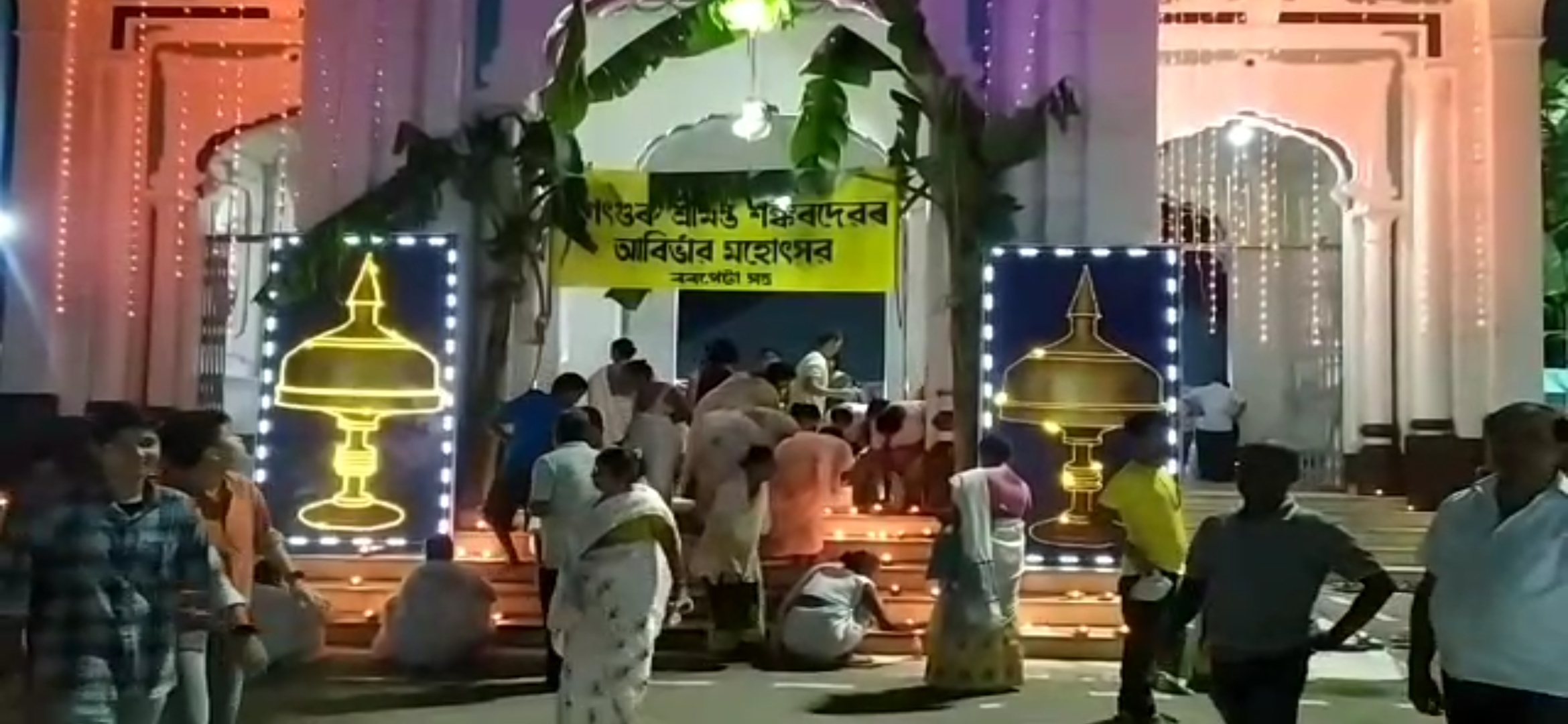 Lighting a lamp at Barpeta Satra