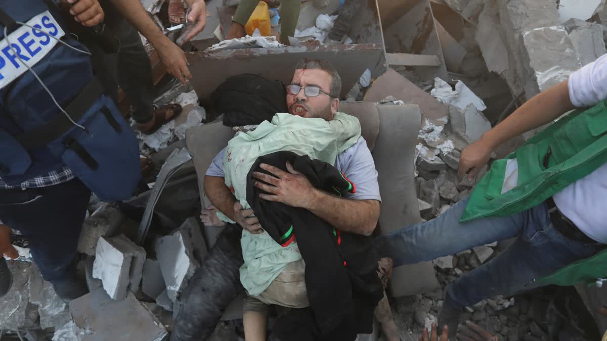 Al Jazeera's chief correspondent in the Gaza Strip, Wael Dahdouh, was helping broadcast live images of the besieged territory's night sky when he received the devastating news: His wife, son, and daughter had all been killed in an Israeli airstrike on Wednesday.  Moments later, the Qatari-based satellite channel switched to footage of Dahdouh entering al-Aqsa Hospital in Gaza before giving way to grief as he peered over the body of his dead son.  "They take revenge on us in our children?" he said, kneeling over his son's bloodied body, still wearing his protective press vest from that day's work.