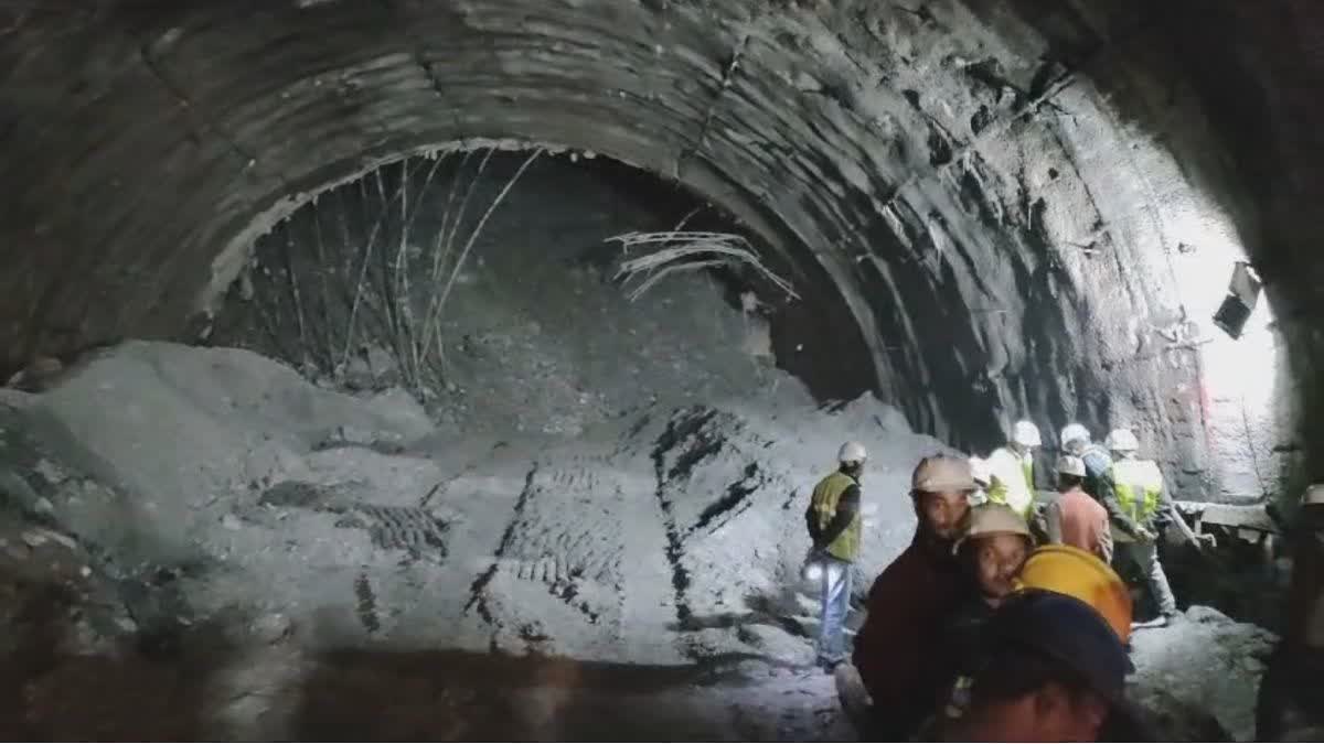 Vertical drilling begins at Silkyara tunnel  escape route for the 41 workers  trapped inside the collapsed tunnel  auger carrying out horizontal drilling broke down  15 metres has been drilled already  rescuers have to drill down 86 metres from above  removal of the auger machine parts is underway  പ്ലാസ്മയും ലേസര്‍ കട്ടറുകളും ഉപയോഗിച്ച് നീക്കും  സ്റ്റേറ്റ് നോഡല്‍ ഓഫീസര്‍ നീരജ് ഖൈര്‍വാള്‍