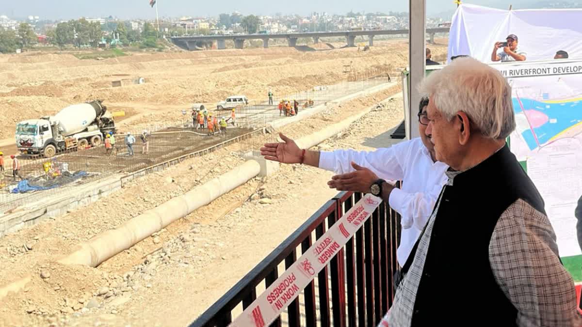 JK LG Manoj Sinha (R) inspects construction work on the Tawi riverfront project in Jammu. LG Sinha has set January 2025 as the new deadline for the project