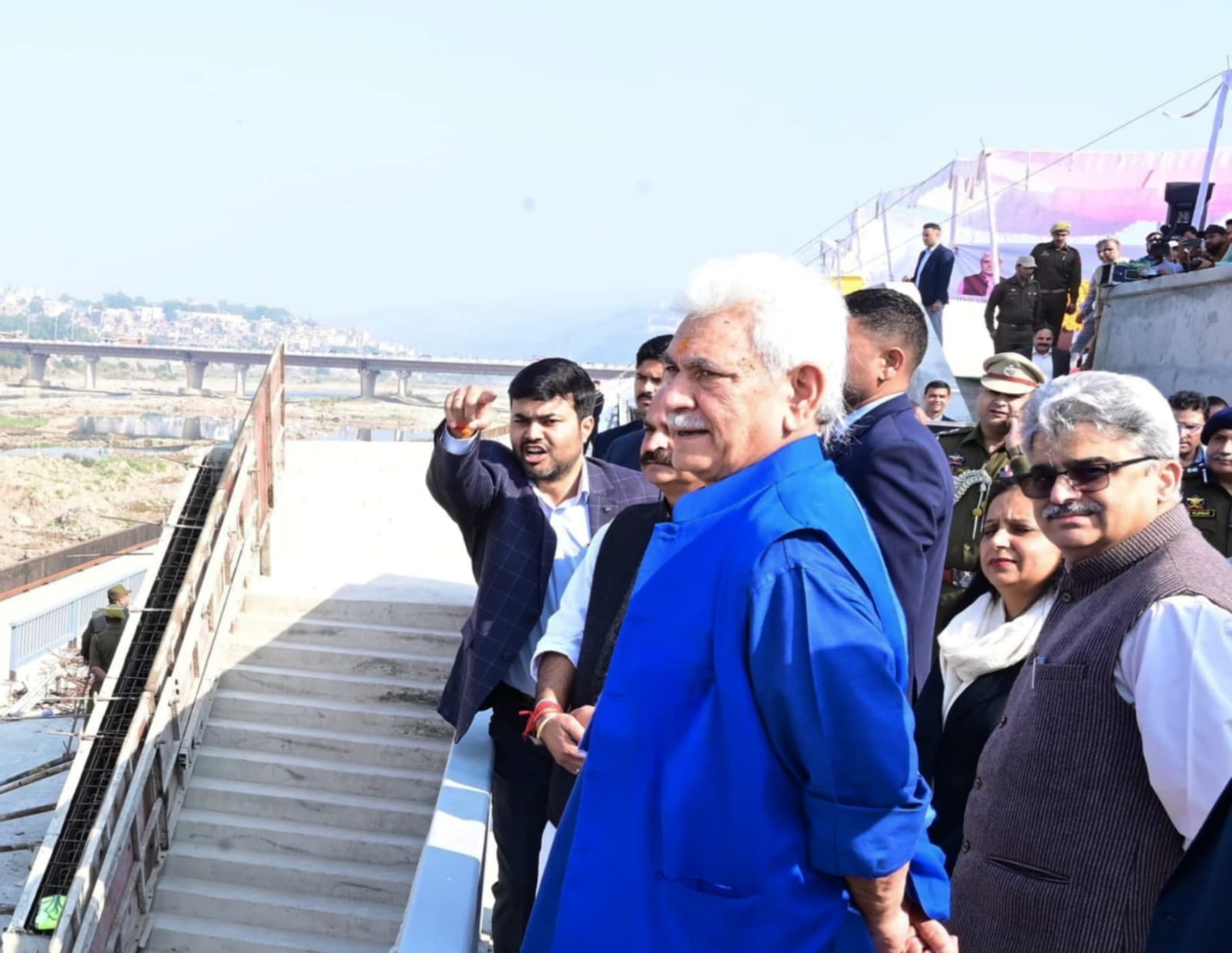 JK LG Manoj Sinha (R) inspects construction work on the Tawi riverfront project in Jammu. LG Sinha has set January 2025 as the new deadline for the project