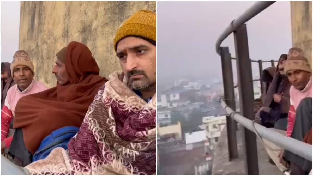 NEXA EVERGREEN SCAM VICTIMS OF FRAUD DEMONSTRATED BY CLIMBING ON A WATER TANK IN JAIPUR