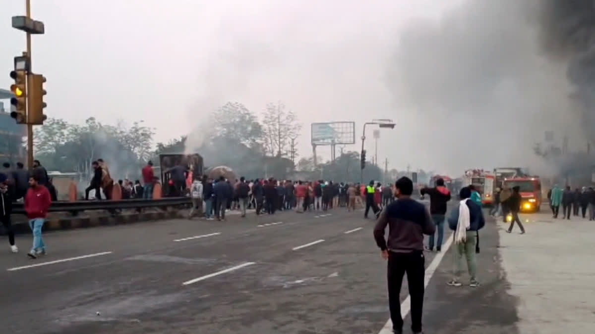 Jaipur: People gather near the site of a massive fire which broke out following a truck collision outside a petrol pump, in Jaipur, Friday morning, Deec. 20, 2024.