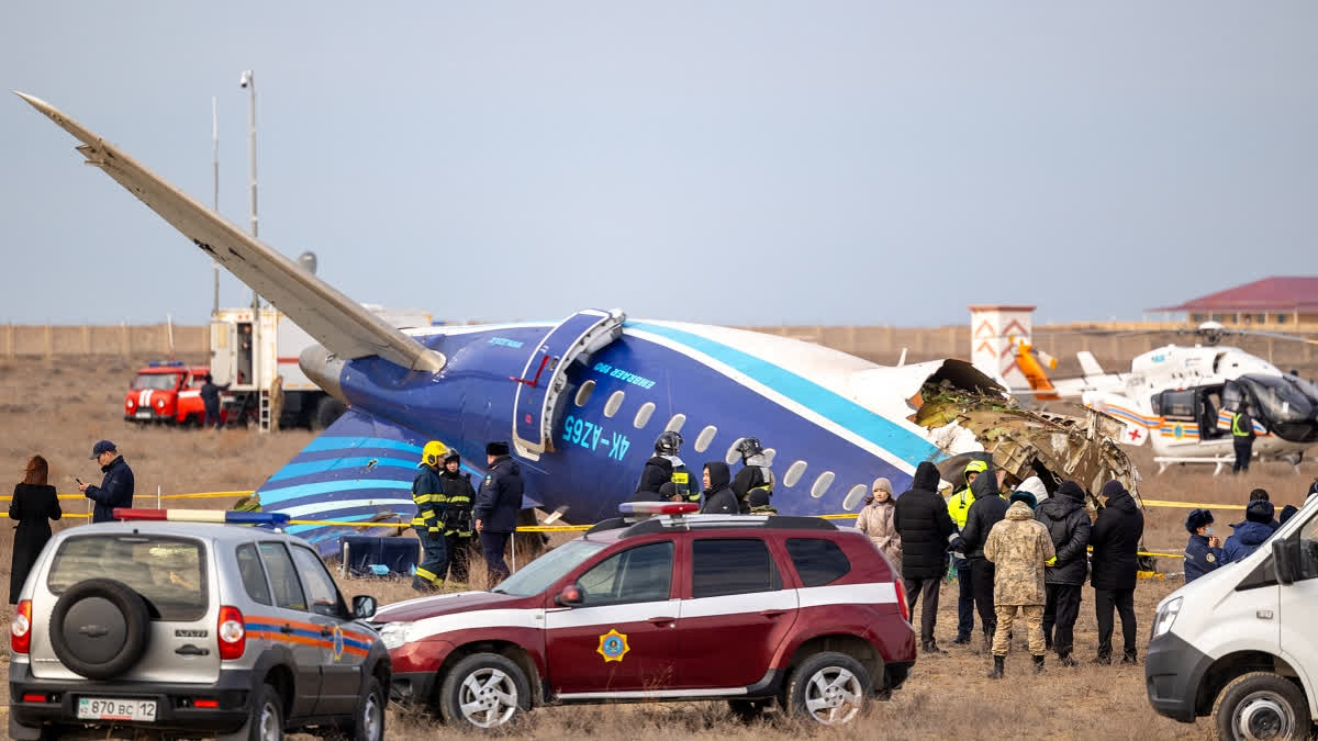 Emergency specialists work at the crash site of an Azerbaijan Airlines passenger jet near the western Kazakh city of Aktau on December 25, 2024.