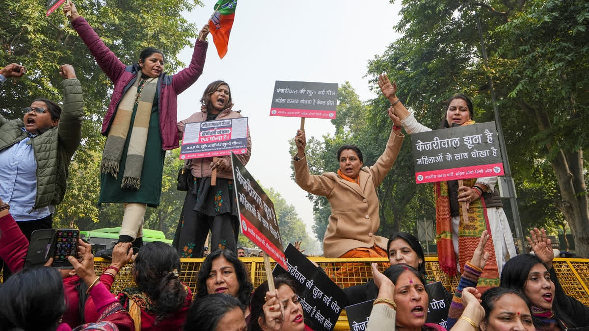 Members of Delhi BJP Mahila Morcha stage a protest near former Delhi chief minister and AAP national convener Arvind Kejriwal's residence, in New Delhi, Thursday, Dec. 26, 2024.