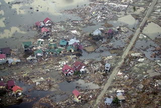 Destroyed houses are seen in this aerial view of the town of Meulaboh in Aceh province, Indonesia, which was flattened by tidal waves, on Saturday, Jan. 1, 2005.