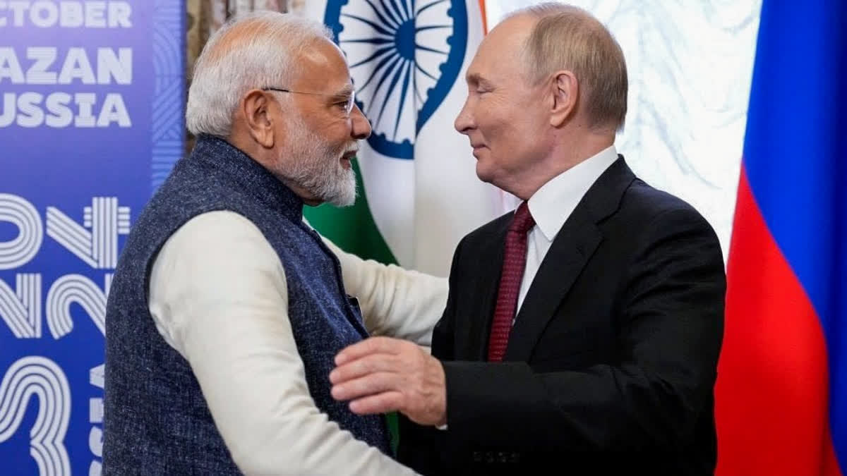 Russian President Vladimir Putin welcomes Prime Minister Narendra Modi at the dinner hosted for BRICS leaders, in Kazan.